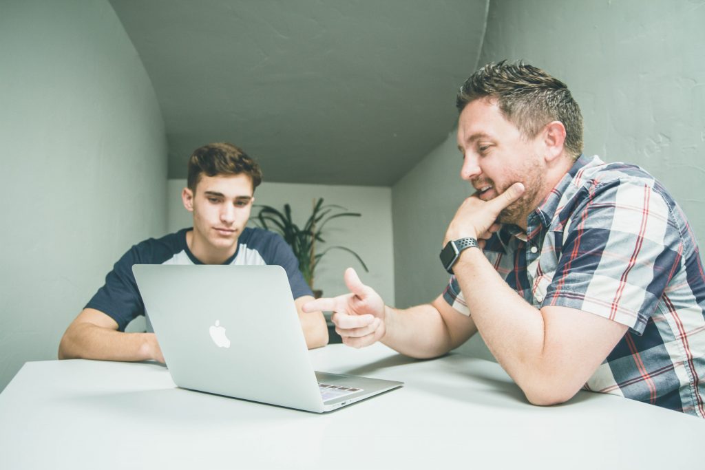 two men discussing work