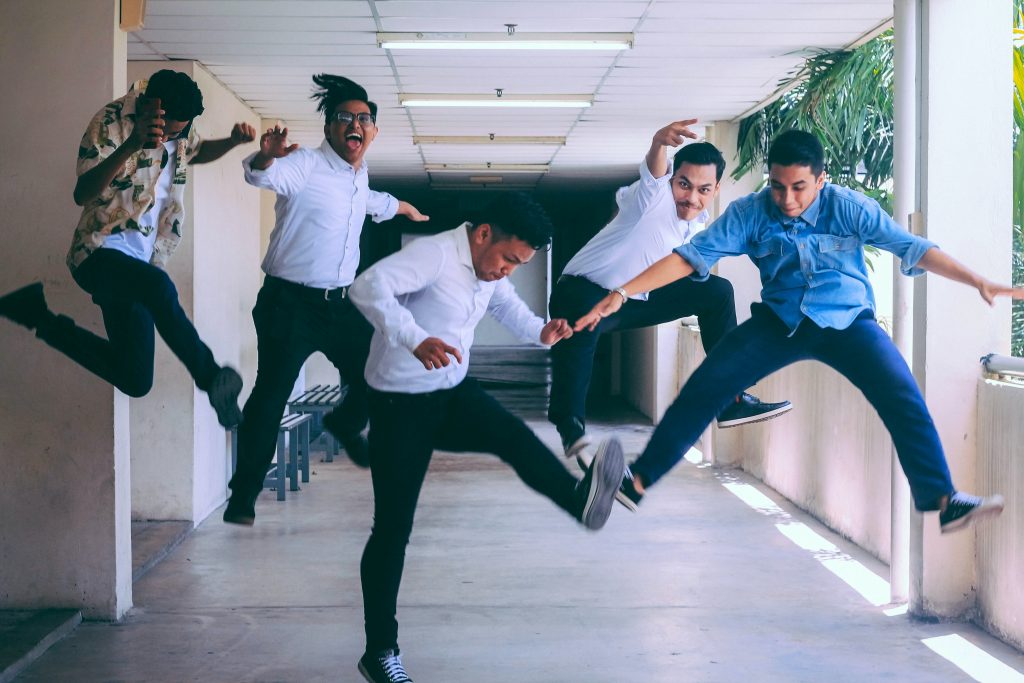happy colleagues jumping