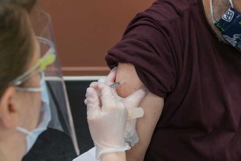 Nurse administrating COVID vaccine